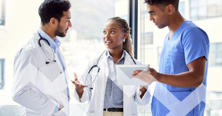 Three clinicians (two physicians and a nurse) consulting over a tablet — illustration for most in-demand physician specialties in 2026
