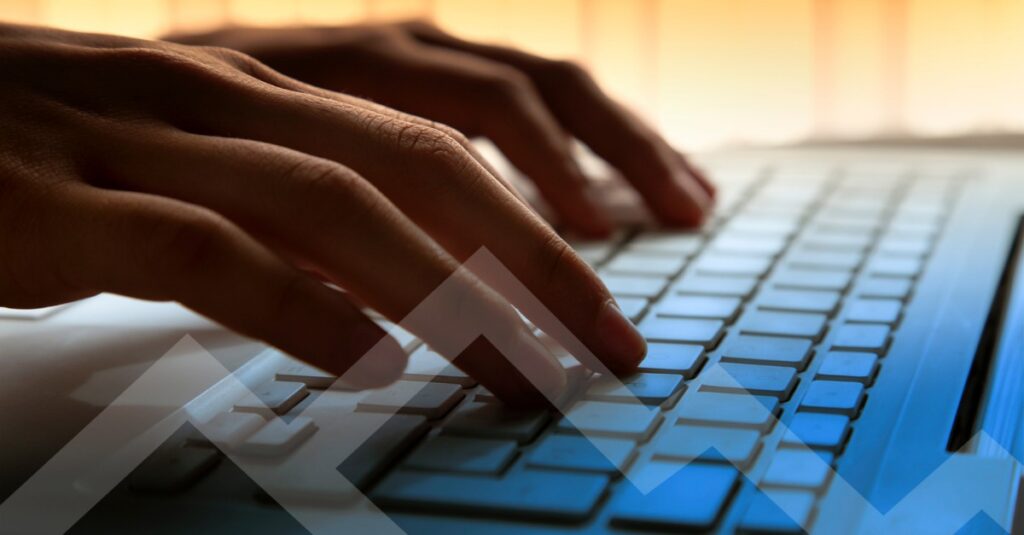 locum tenens physician writing CV and typing on keyboard