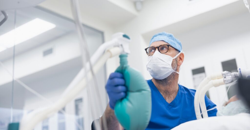 An anesthesiologist providing ventilation support during a surgical procedure, demonstrating anesthesia staffing solutions for hospital and surgical care teams.